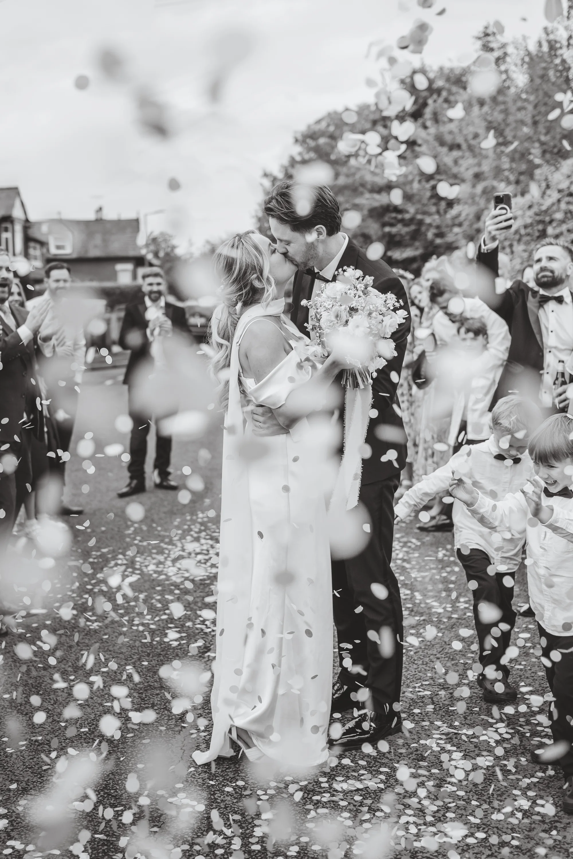 Claudia and Andy celebrating in a shower of confetti
