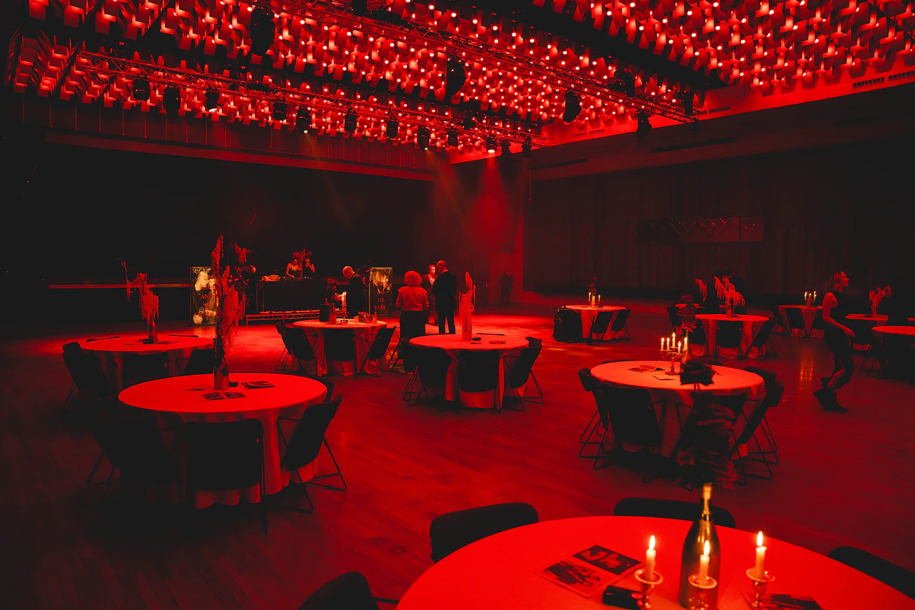 The dramatic red-lit backdrop at Ben and Meg’s wedding