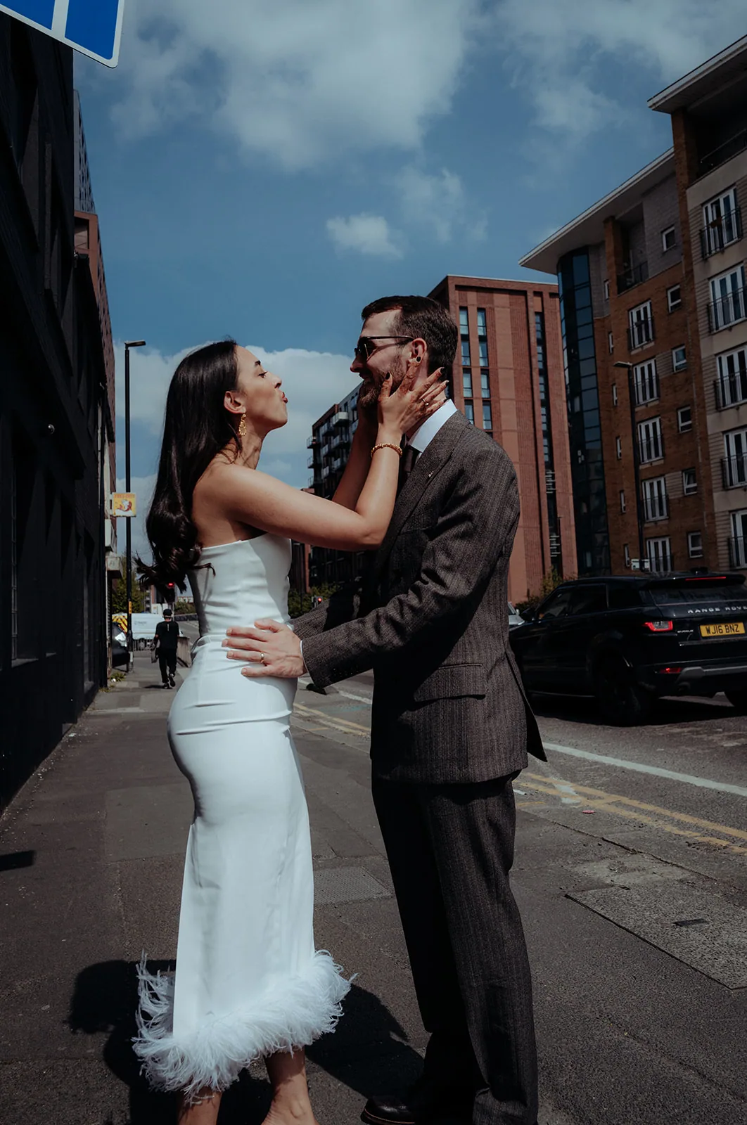 Hannah and Harry sharing a playful moment in the city