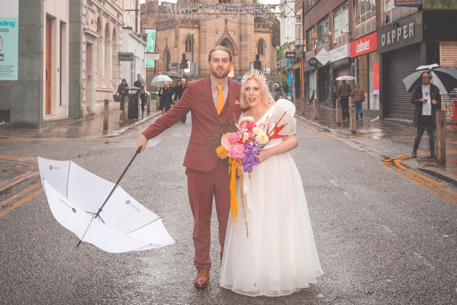 Jamie and Will together beneath an umbrella on Bold Street