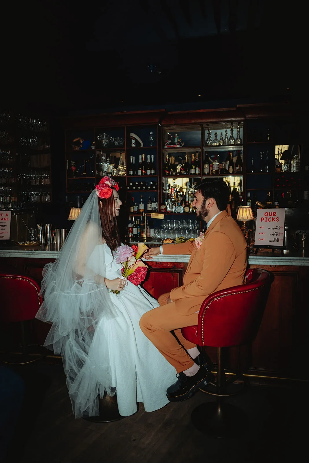 Gwen and Nate sharing a quiet moment at the bar