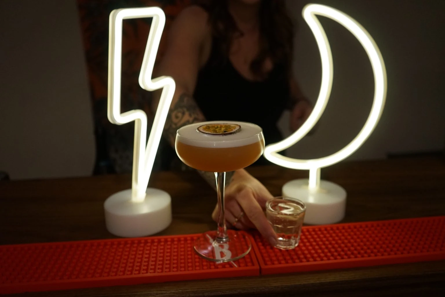 A passion-fruit cocktail and shot served on the Alt Events Co. mobile bar